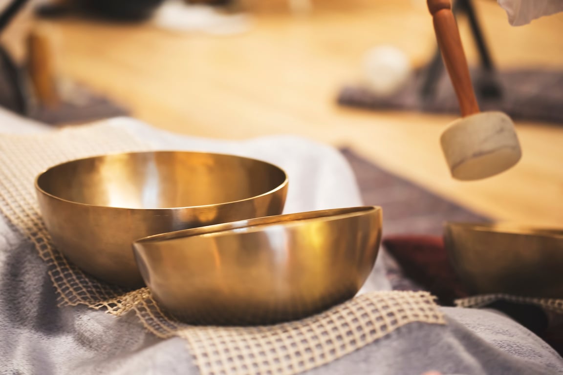 Playing on Tibetan bowls sound therapy